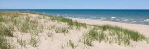 A beach with sand dunes and grass. - The "Pool Barn" w/Pool, Hot Tub,  Billiards & more near Indiana Dunes (Porter)