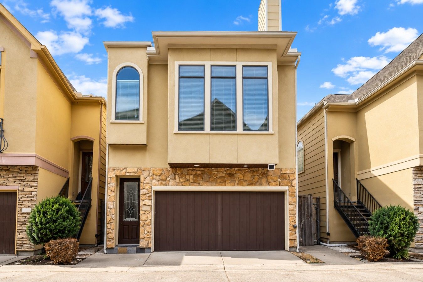 Exterior view of the spacious three-story townhome, ideally located near Houston’s popular Uptown Galleria area.