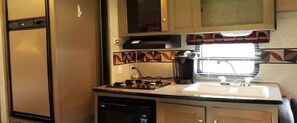 Fridge, microwave, stovetop, coffee/tea maker