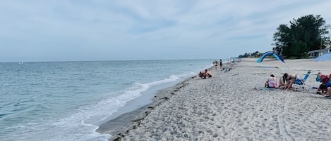 On the beach, sun loungers, beach towels