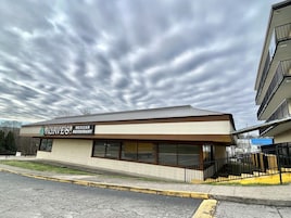 A two-story building with a sign for 'Agave's Mexican Restaurant' on the ground floor.