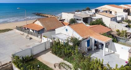 house on the beach with a nice patio