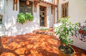 Stroll through this charming courtyard, surrounded by traditional architecture and lush greenery.