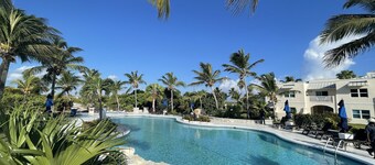 Seas the Day TCI covered balcony, patio dining, gated entrance, on site security