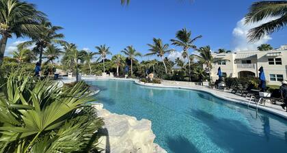 Seas the Day TCI covered balcony, patio dining, gated entrance, on site security