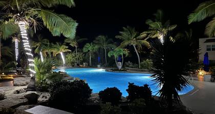 Seas the Day TCI covered balcony, patio dining, gated entrance, on site security