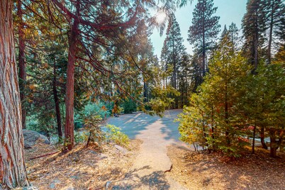 Two-story dog-friendly condo with balcony, washer/dryer, & full kitchen