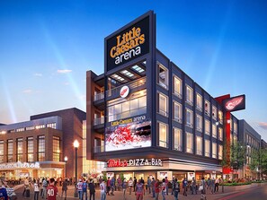 Home to sports and entertainment events, the Little Caesars Arena features a prominent logo and digital display.