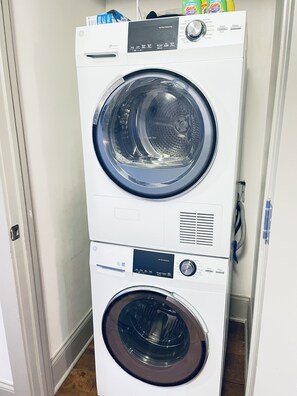 Convenient laundry facilities feature a washer and dryer unit with digital controls.