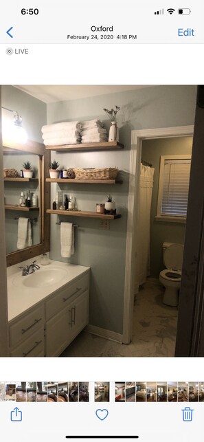 Combined shower/tub, hair dryer, towels, soap