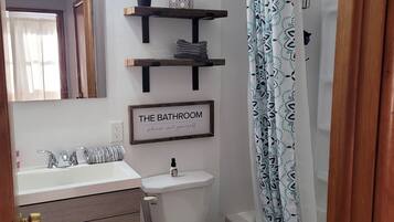 Combined shower/bathtub, hair dryer, towels, soap
