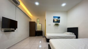 A hotel room with two beds, a TV, a desk with a chair, a mirror, and a painting on the wall. - Hotel O Taman Kota Homestay (Keningau)