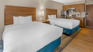 A hotel room with two beds, a kitchenette, and a bathroom. - MainStay Suites Oak Brook Terrace-Chicago (Villa Park)