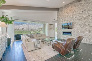 Smart TV, fireplace, books, stereo
