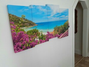 A large panoramic painting of a coastal landscape with vibrant purple flowers and a clear blue sky. - House ~ Near Airport “ATL”. Weekly & Monthly Discounts! Free WiFi & Parking! (Union City)