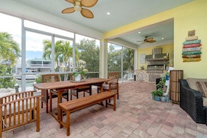 Enjoy meals with family and friends at the large dining table, surrounded by natural views of the landscape.
