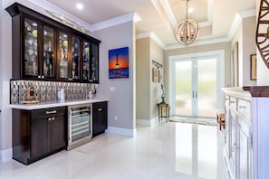 Enjoy cooking in this well-equipped kitchen with a microwave and glass-front cabinetry.