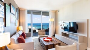 A modern hotel room with a large balcony, a flat-screen TV, and a cozy seating area. - Hyde Side Ocean View 1 Bedroom Condo by RedAwning (Hollywood)