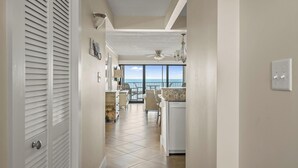 A hallway leading to a balcony with a view of the ocean. - Oceana 1-Upgraded 2 Bedroom Ocean Front Oceana Condo with Outdoor Pool! (Ocean City)