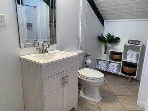 Combined shower/tub, hair dryer, towels, soap