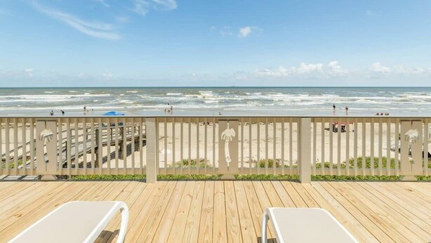 A wooden deck with two white lounge chairs facing the ocean. - Stunning Ver La Mer - Direct Ocean & Beach Access! (Surfside Beach)