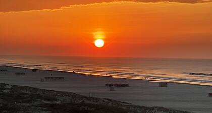 Two bedroom condo with deck overlooking the ocean. Private beach!