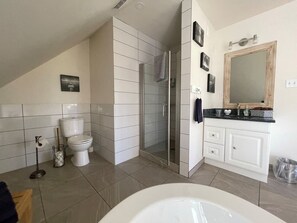 Shower, jetted tub, towels, soap