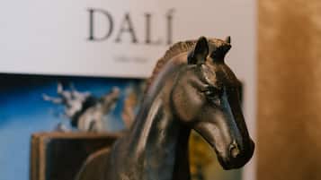 A bronze horse statue on a pedestal.