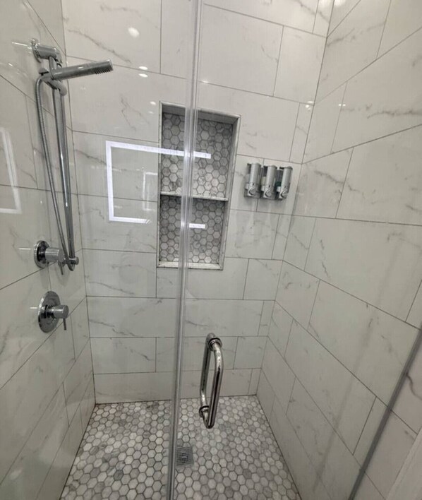 Shower, hair dryer, towels, soap