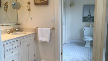 Bathtub, hair dryer, towels, soap