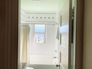 Bathtub, hair dryer, towels, soap