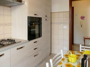 Fridge, oven, toaster, cookware/dishes/utensils