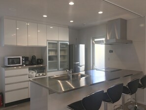 Fridge, microwave, stovetop, cookware/dishes/utensils