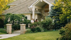 A house with a sloped roof, brick exterior, and a front porch with steps leading to a door. - The perfect place for a vacation or reunion.  (Saint Anthony)