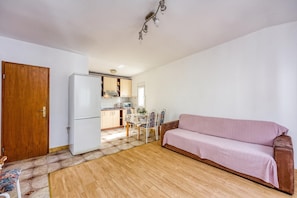 A compact living space with a kitchenette, a dining area, and a sofa. - Seaside Apt Basic 1 w/ Balcony, Vir, Croatia (Vir)