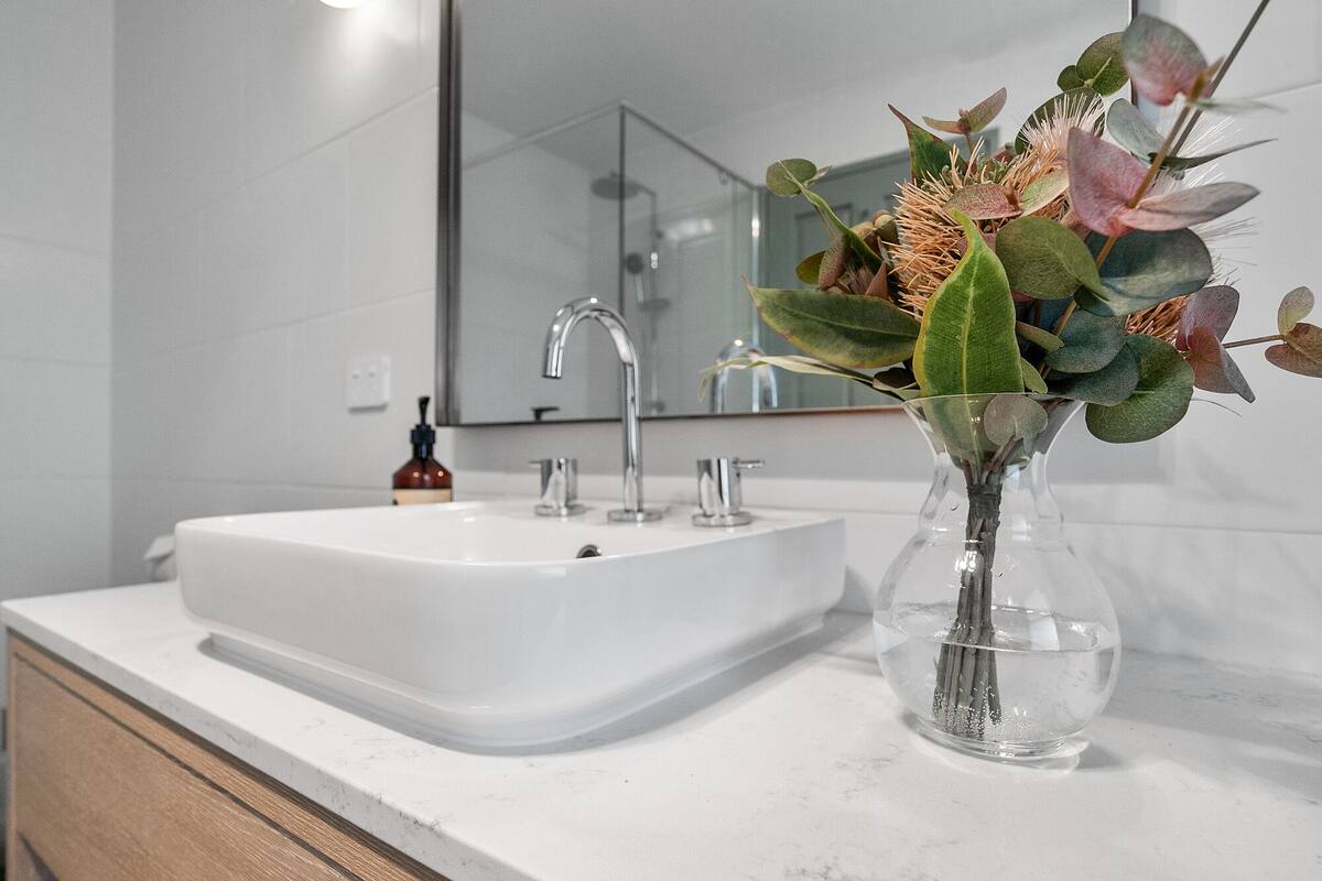 designer toiletries, hair dryer, dressing gowns, towels