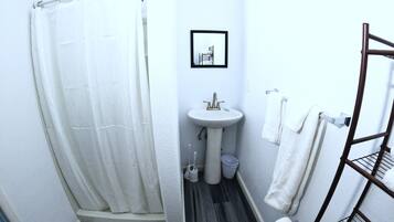 Shower, hair dryer, towels, toilet paper