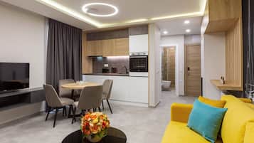 Comfort Apartment | Living area | 42-inch LED TV with satellite channels, TV, Netflix