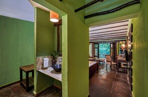 Deluxe Room | Minibar, in-room safe, desk, blackout drapes - WelcomHeritage Jungle Home (Kurai)