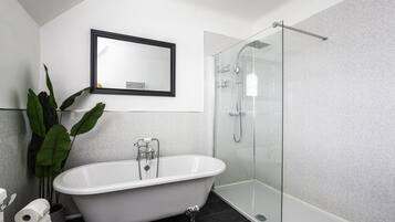 Bathtub, hair dryer, towels, soap