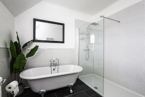 Bathtub, hair dryer, towels, soap