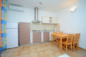 Apartment, 1 Queen Bed with Sofa bed | Private kitchen | Fridge, stovetop, electric kettle, toaster