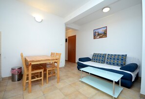 Apartment, 1 Queen Bed with Sofa bed | Living room | 30-inch TV with digital channels