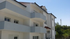 A multi-story building with balconies, a staircase, and a flat entrance area. - A7 - apt With 2 Balconies, 5 min Walking to Beach (Podstrana)