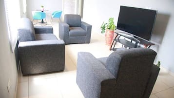 Apartment | Living area | 30-inch TV with digital channels