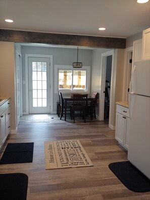 Enjoy meals in the kitchen with a central island and dining area.