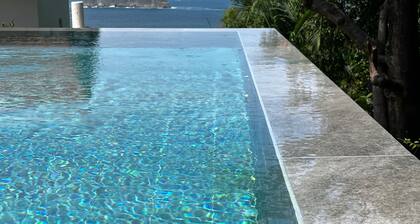 Stunning one bed/bath unit. Breathtaking ocean/jungle views with infinity pool!
