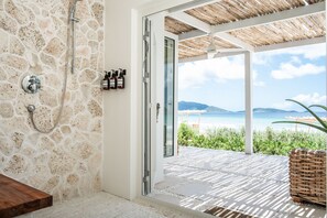 Oceanfront Suite | Bathroom | Shower, hair dryer, bathrobes, towels - Long Bay Beach Resort (West End)