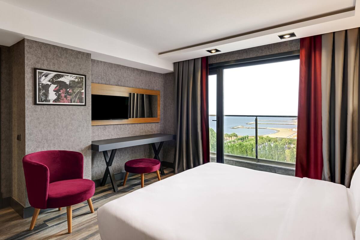 Junior Suite, Multiple Beds, Partial Sea View | Minibar, in-room safe, desk, soundproofing