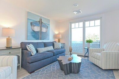 Condo unit with balcony overlooking harbor